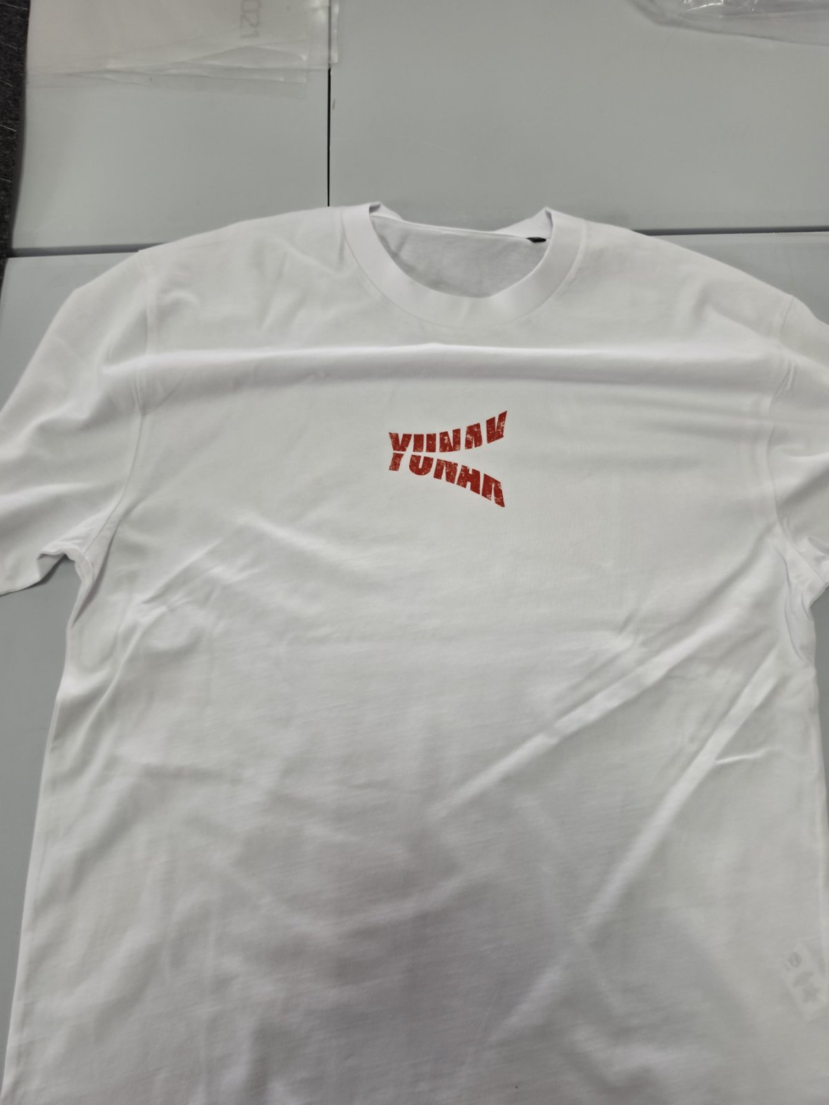 Person wearing a black t-shirt with graphic design of Maki Zenin from Jujutsu Kaisen on the back, standing against a white background