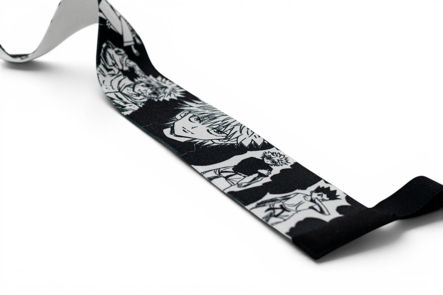 Embroidered anime wrist wraps inspired by Killua and Gon from HunterxHunter. Anime lifting wraps for the gym. Close detail shot