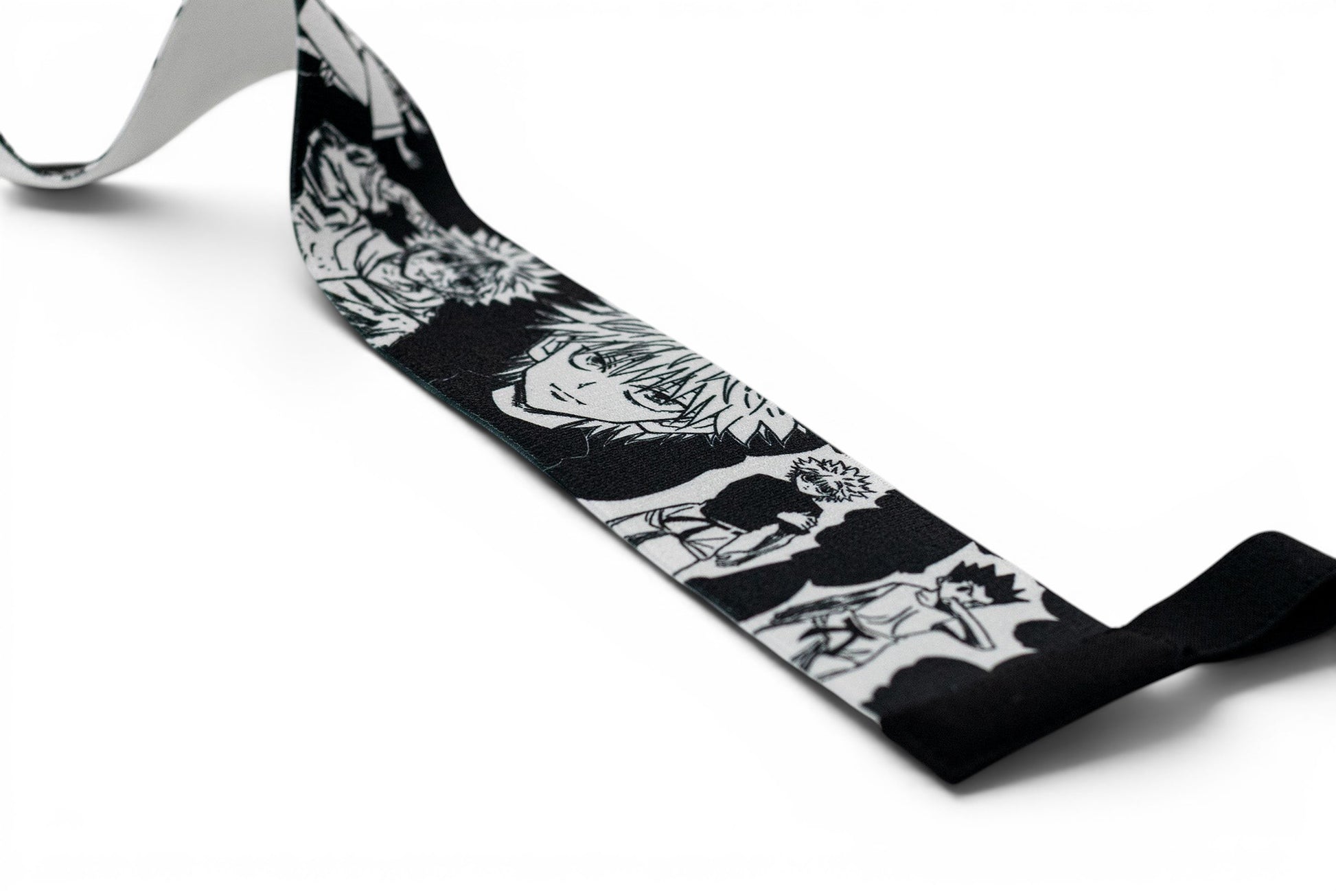 Embroidered anime wrist wraps inspired by Killua and Gon from HunterxHunter. Anime lifting wraps for the gym. Close detail shot