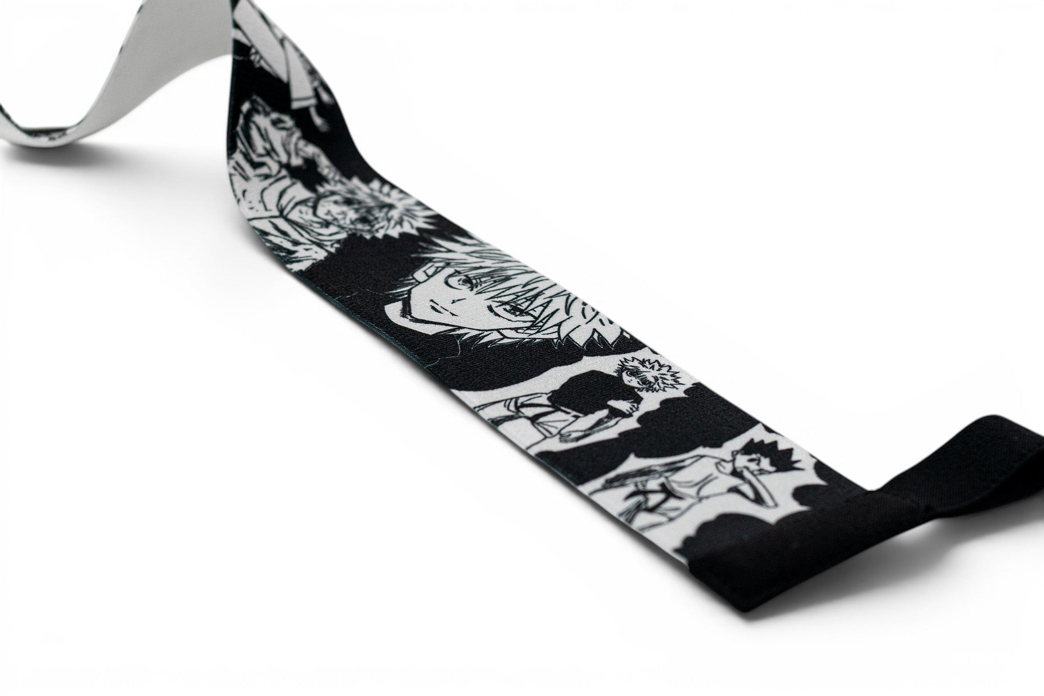 Embroidered anime wrist wraps inspired by Killua and Gon from HunterxHunter. Anime lifting wraps for the gym. Close detail shot