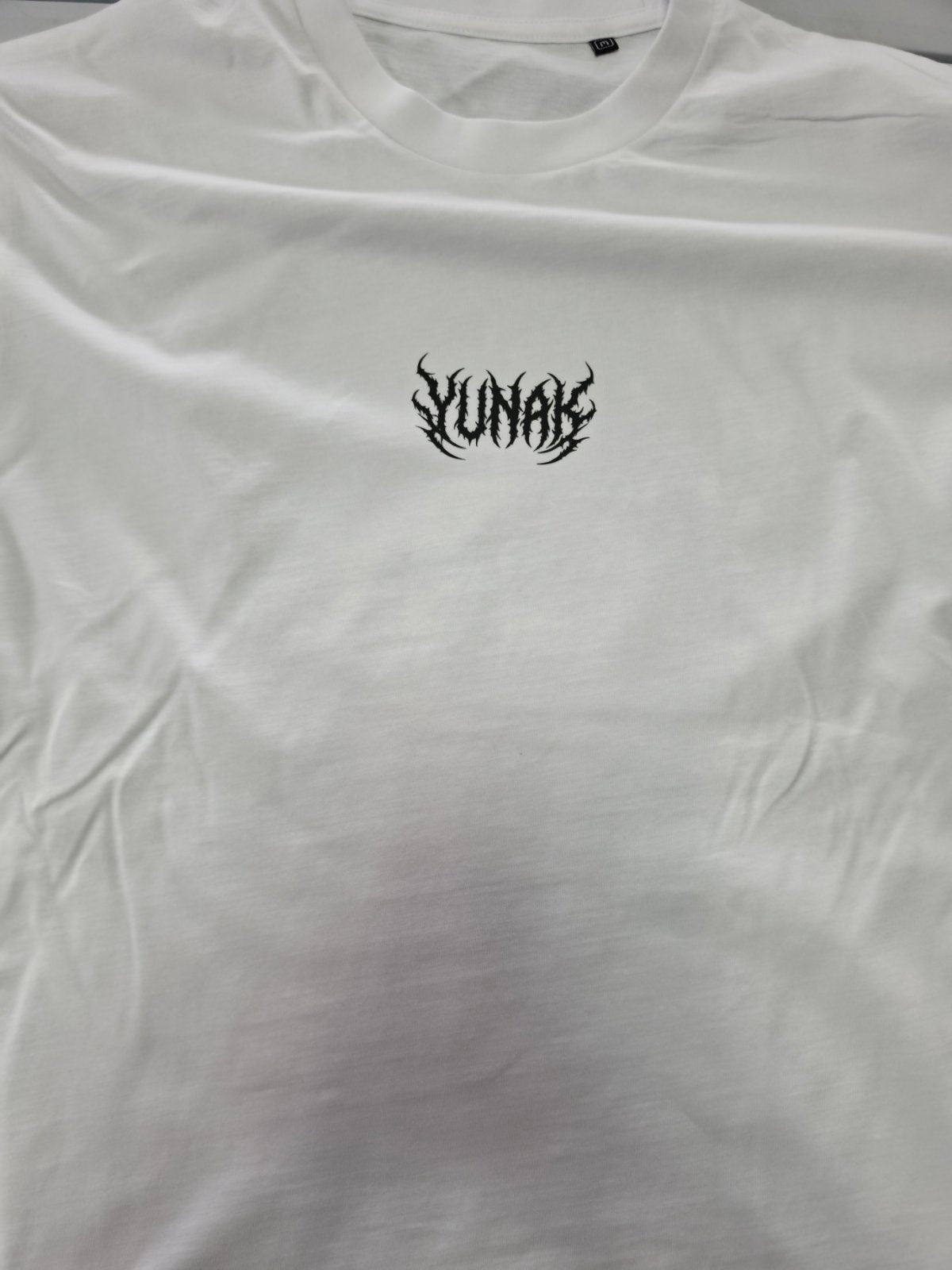 Person wearing a black t-shirt with graphic design of Yuji Itadori from Jujutsu Kaisen on the back, standing against a white background