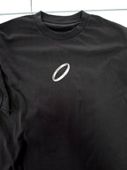 Person wearing a black t-shirt with graphic design of Yuta from Jujutsu Kaisen on the back, standing against a white background